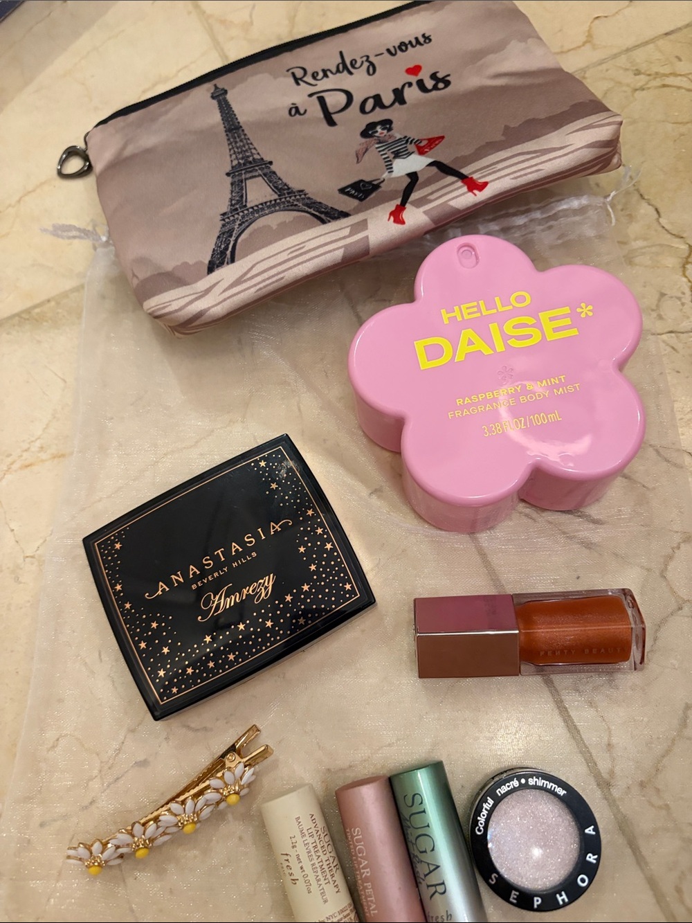 Fenty Beauty pink daisy-shaped body mist & makeup pouch set